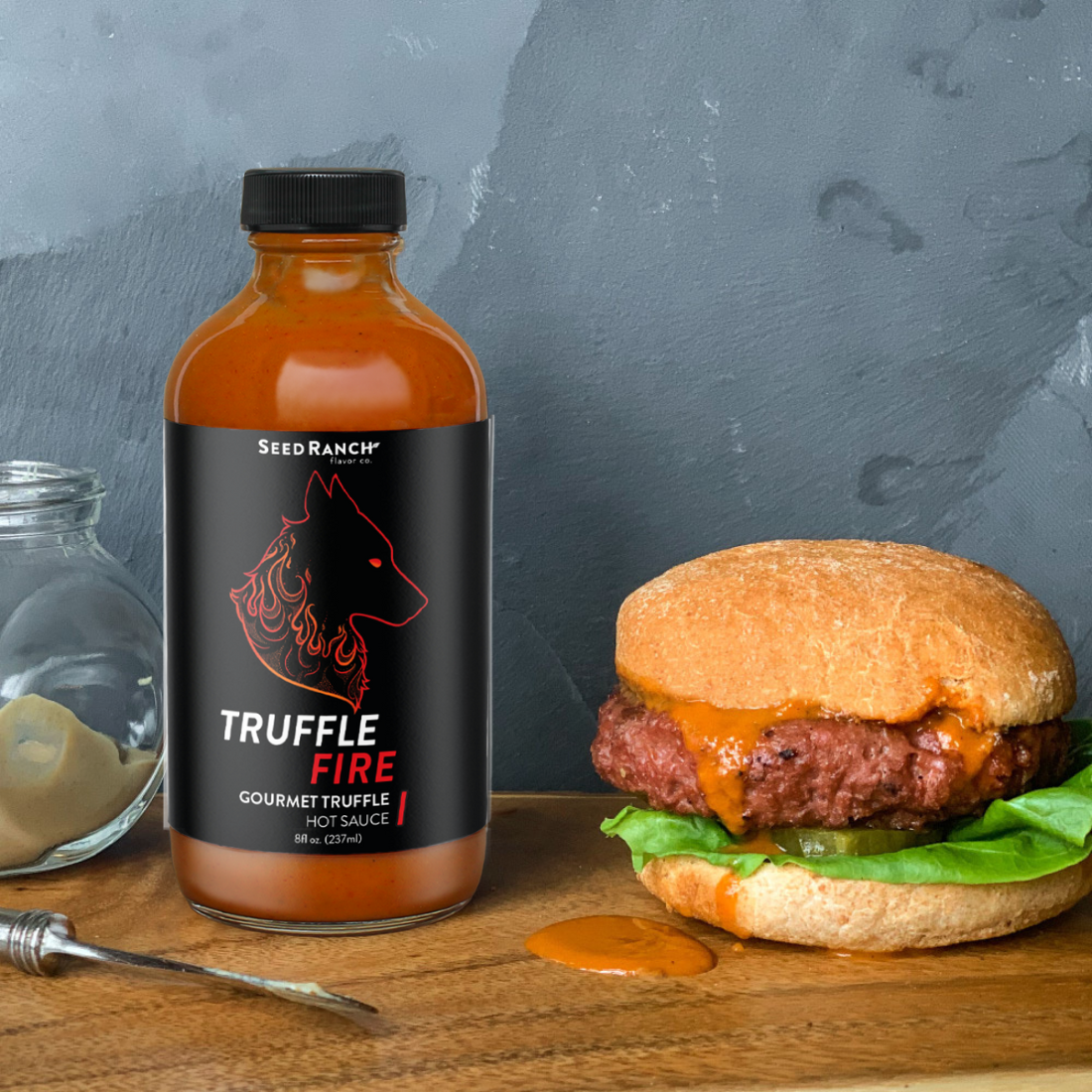 Seed Ranch Flavor Co, The truffle hot sauce fire dumplings spread on the Burger steak.